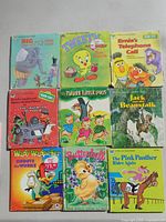 Group shot of nine children’s books laid in 3×3 grid