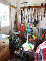 Overall view of long-handle tools, spreader, power tools, cords