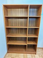 front view of entire bookcase showing shelves and two-column design
