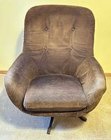 Front view showing brown corduroy upholstery, tufted back, removable cushion, swivel base
