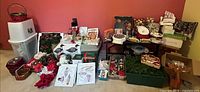 Wide view of entire lot showing ornaments, lights, dishes, greenery, wrapping paper bin and accessories