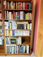 Front view of the full bookcase showing shelves and finish
