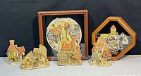 group shot of all resin cottages and both framed reliefs