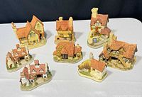 Group shot of all eight David Winter cottages on table