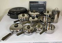 Full set of cookware, roaster, rack, tray and canister displayed
