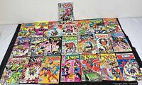 Full lot overview showing all 22 comic books laid out