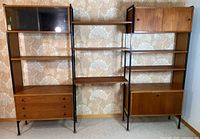 Full frontal view of entire modular wall unit with all shelves, drawers and cabinets visible