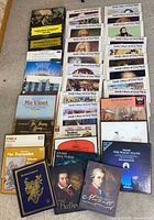 Full lot overview showing stacked LPs, box sets and book records