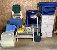 Group shot showing bins, drawer tower, laundry basket, mop and wire shelf
