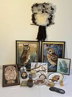 Group shot of all owl décor items on table and wall