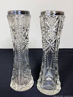 Front view of both cut crystal vases showing full height and pattern