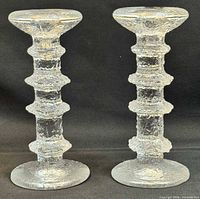 Pair of Iittala Festivo textured glass candlestick holders full view front