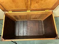 open view showing interior storage compartment and hinges