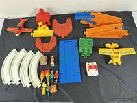 Full lot layout showing all Fisher-Price parts, vehicles, track, figures and accessories