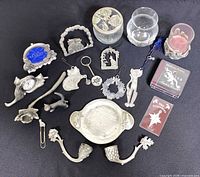 Top view of entire 18-piece pewter and glass lot