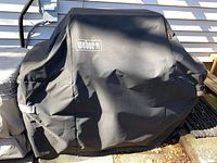 Grill fully covered with Weber cover
