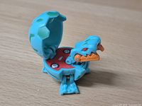 Bakugan open side view showing orange jaw, red 300 G plate