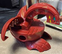 Bakugan figure opened, showing interior mechanics and coloration