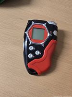 Front view showing screen, buttons, colour scheme