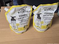 Front view of both sealed JR Watkins lemon foaming hand soap refill pouches