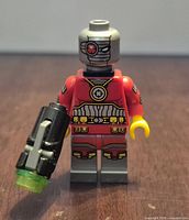 Front view of Deadshot minifigure holding blaster