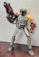 Front angled view of assembled Boba Fett figure with blaster