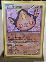 Front of sleeved Stunfisk RC12/RC25 holo card