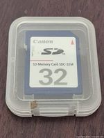 Canon 32MB SD card inside clear plastic case