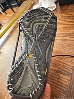 ice cleat fitted to boot sole showing rubber frame and metal coils