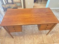 Full view of desk showing top, drawer pedestals and tapered legs