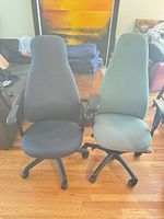 Front view of both chairs showing upholstery colors, armrests, bases
