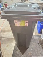 Front view showing label, lid and overall condition
