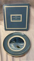 Front view of plate and original box showing design, inscription and packaging