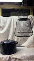 Full view of basket hanging and stock pot with lid