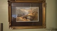 Front view of framed landscape print in gold frame showing artwork, matting and frame condition