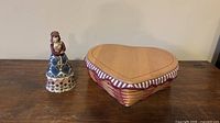Basket with lid and Jim Shore figurine shown together