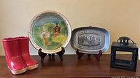 Group view of plate, tray, lantern, boot planter, stands