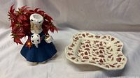 Figurine and dish side by side showing scale and design