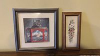 Both framed artworks side by side showing sizes, frames and subjects