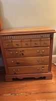 Front view showing drawer configuration and hardware