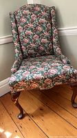 Front view of floral wingback chair