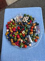 Tray showing assorted beads and packaged findings