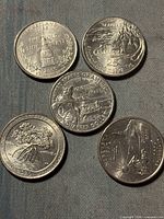 Group shot of five statehood quarters showing obverse designs