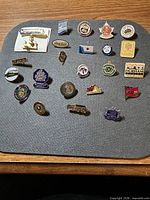 Overview of all 20 Ontario lapel pins on display board