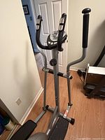 Full view of Fitness Club elliptical trainer showing frame, handlebars and pedals