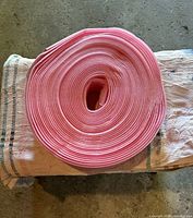 Rolled pink foam sill gasket on cloth