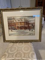 Framed limited edition print showing Prince of Wales Hotel scene, matting and gold frame visible