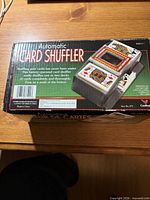 Front of retail box showing Automatic Card Shuffler branding and imagery