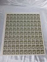 Front view of entire stamp sheet showing 100 stamps