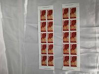 Front view of two panes of mint Canada 8¢ stamps, 10 per pane